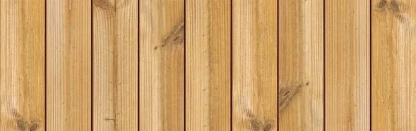 Scandinavian thermally modified wood sample with golden tones and visible knots